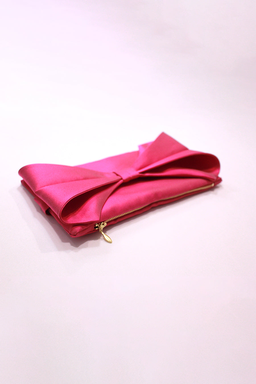 Bow Clutches in Pink, Emerald, and Fuchsia