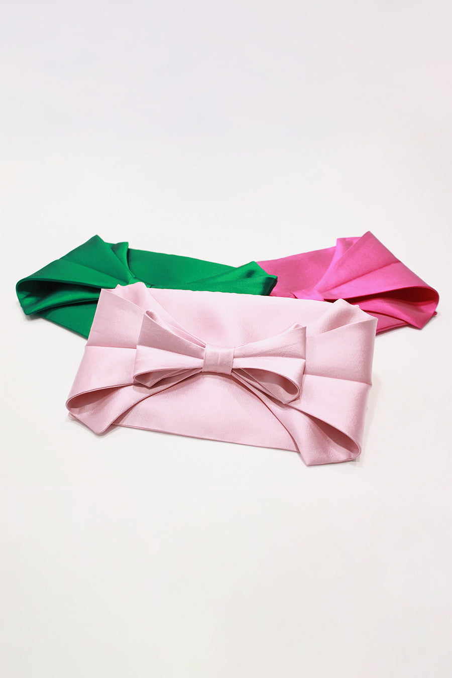 Bow Clutches in Pink, Emerald, and Fuchsia