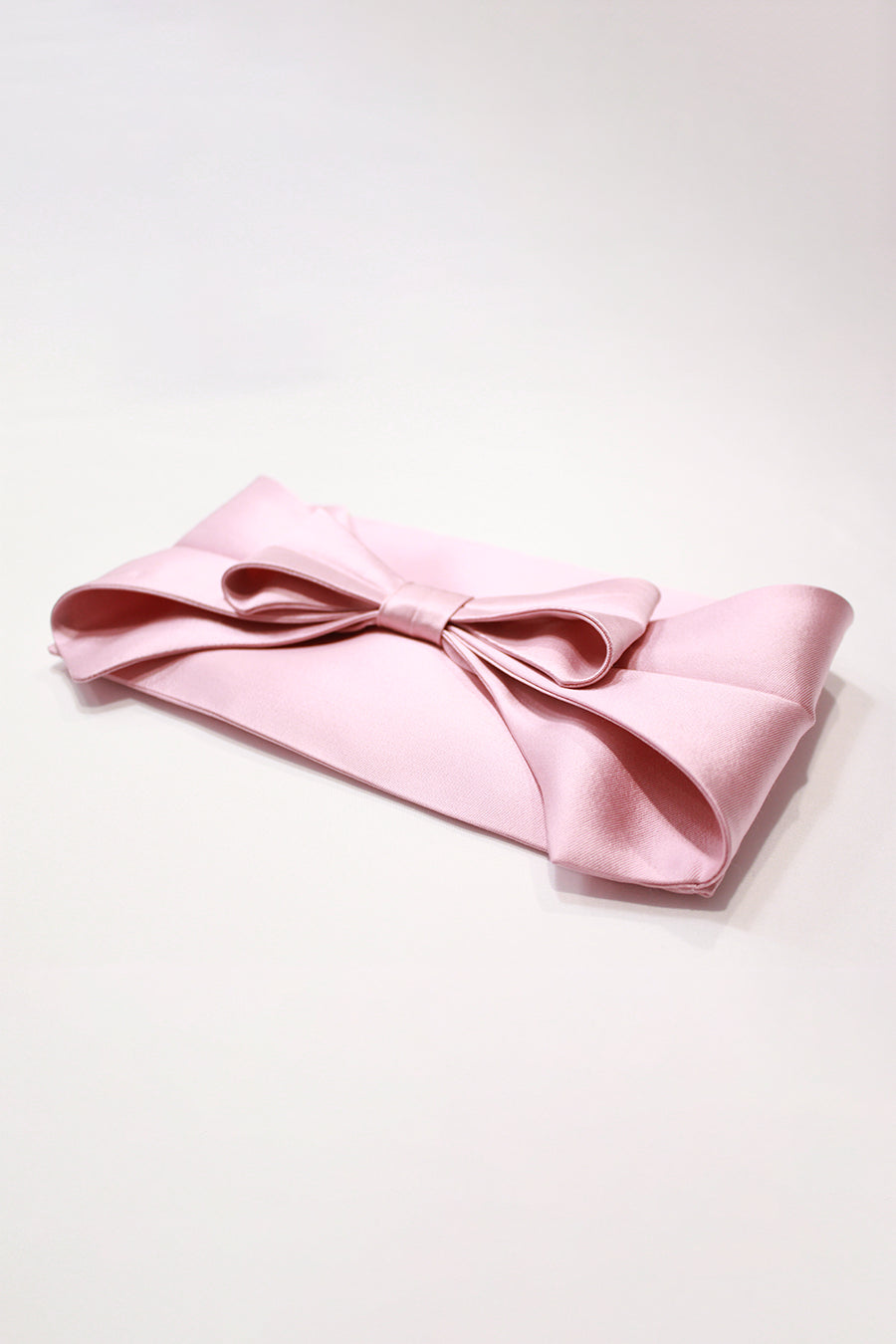Bow Clutches in Pink, Emerald, and Fuchsia